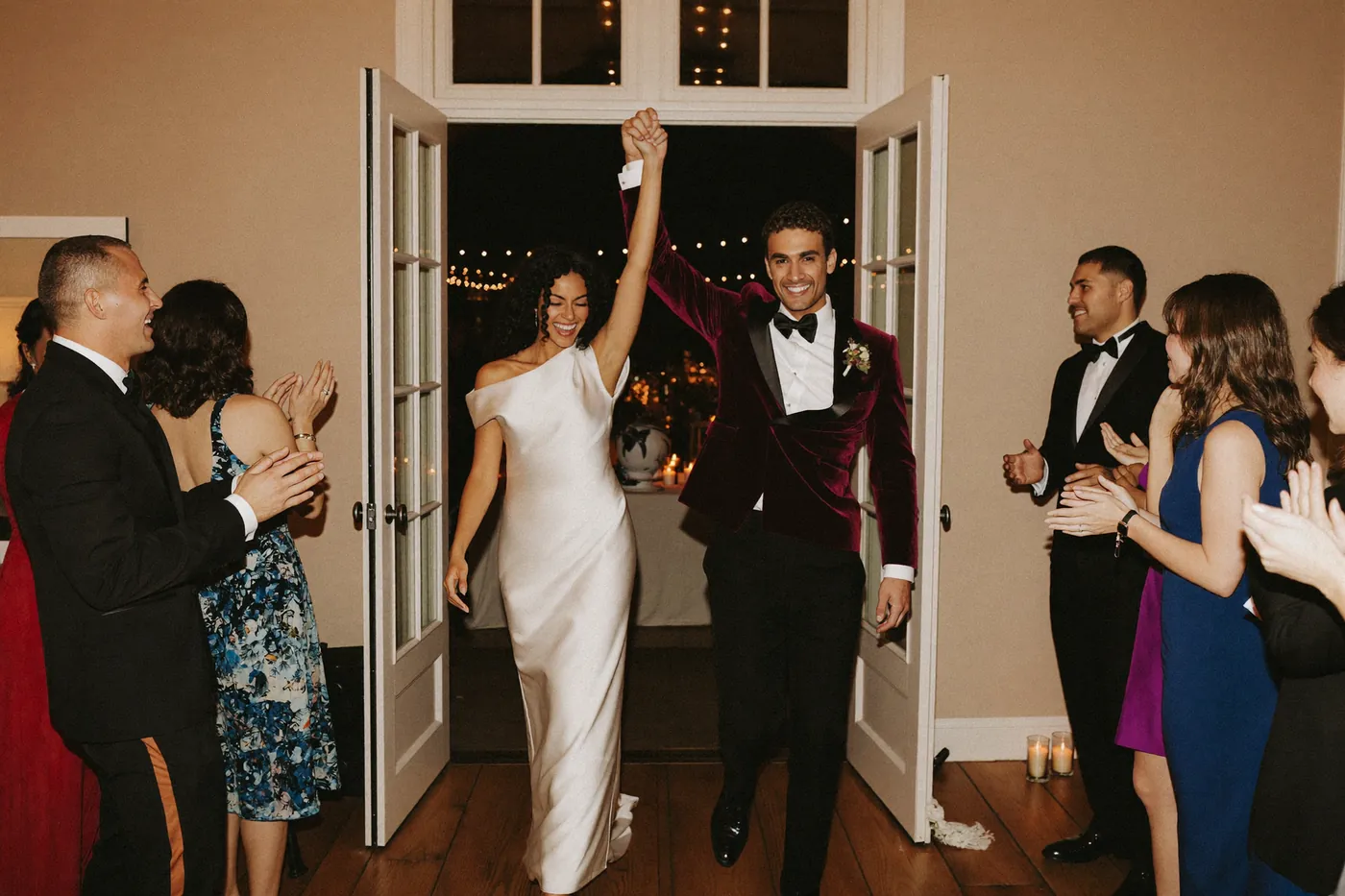 Example: a newlywed couple making their grand entrance into their reception as guests cheer